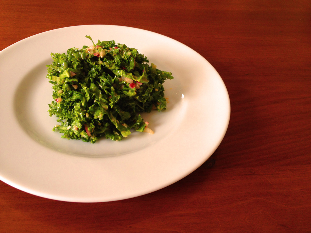 Kale Slaw with Sesame Honey Dijon Dressing. For an additional touch, serve with a small, crisped piece of thick-cut bacon, crisped bacon pieces. Photo © Ben Young Landis.